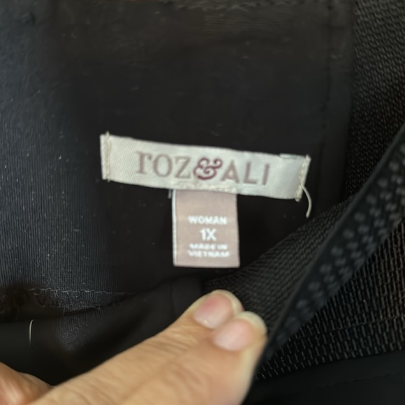 Black fitted skirt. Poly/Nylon/Spandex. Zipper in the back. Elastic waistband. - Picture 2 of 3